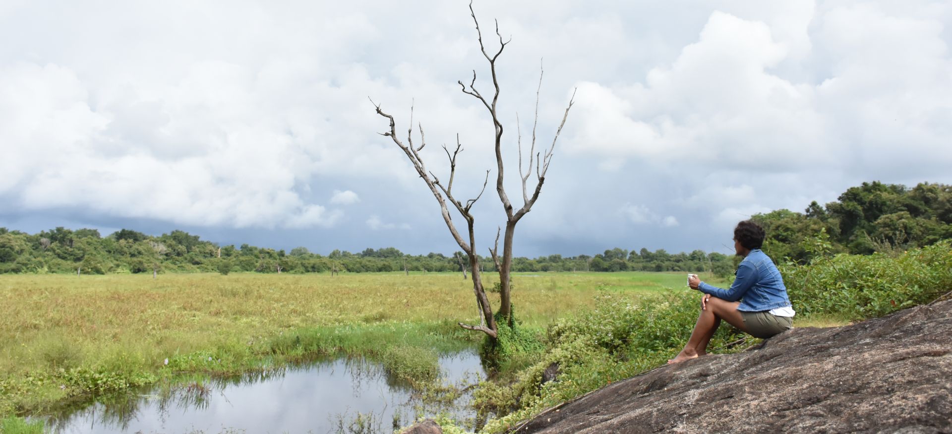 a lady relaxing at wasgamuwa national park in sri lanka